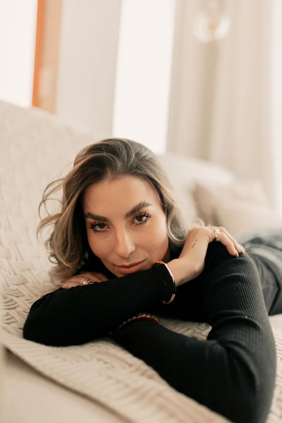 Woman at home in the days before her period, when perimenopause night sweats often appear