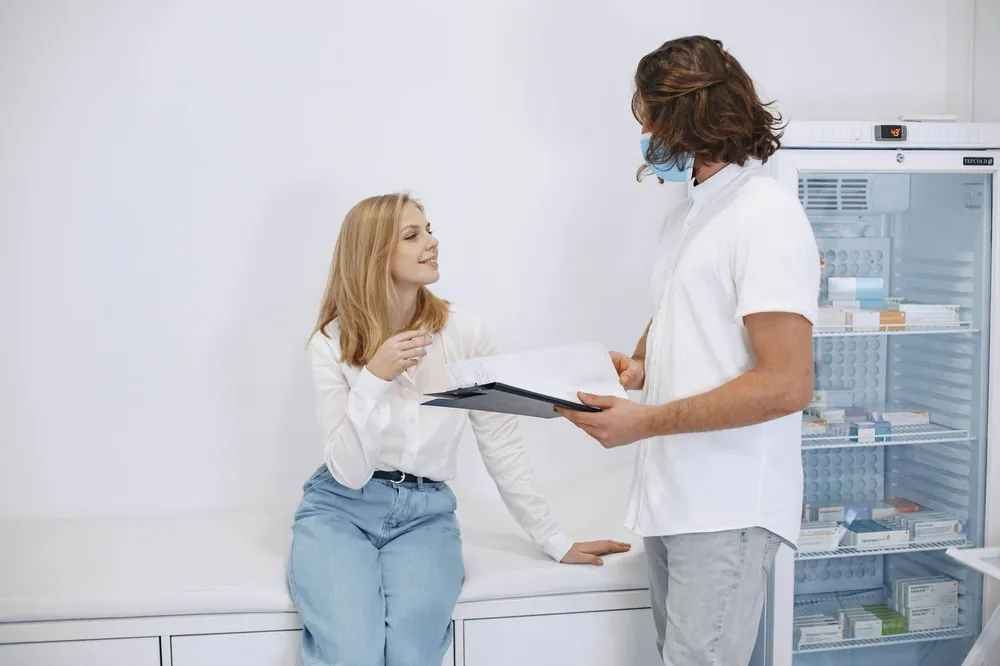 Woman discussing perimenopause night sweats with her doctor